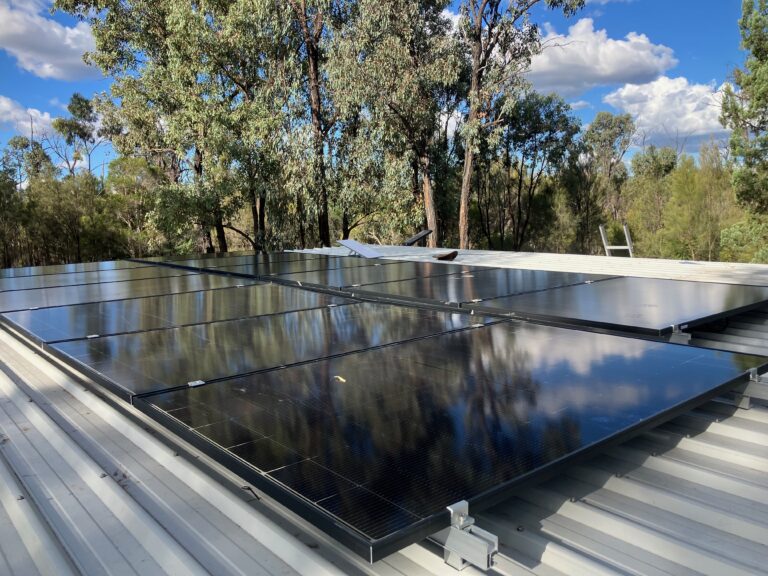 Rooftop solar panels installed on a metal roof