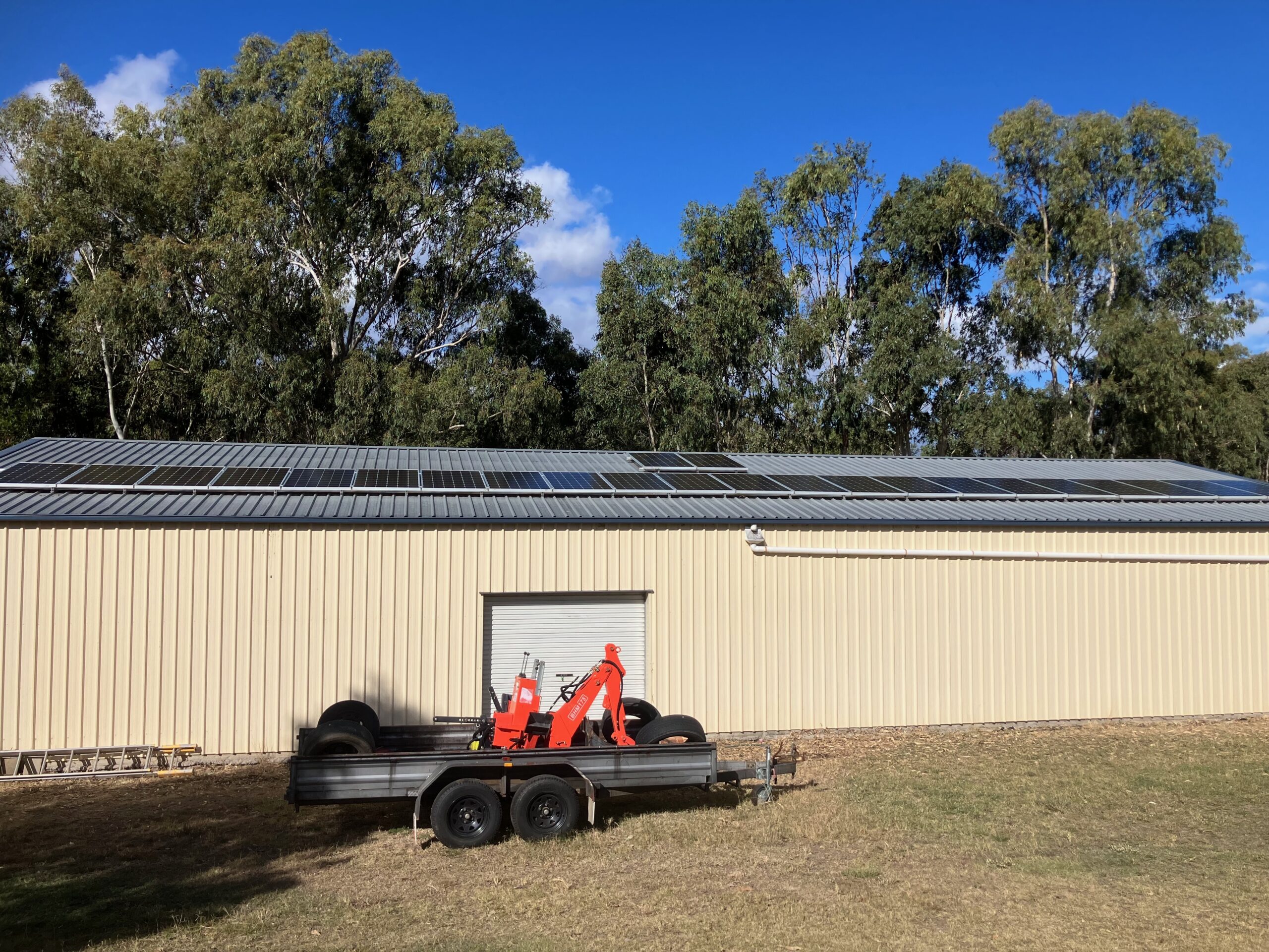 Solar panels installed on a shed roof for off grid power